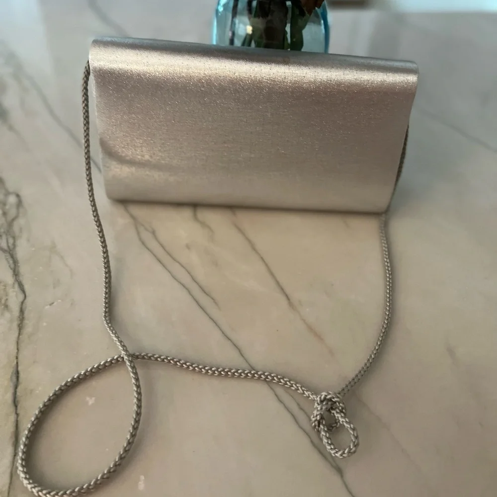 Fancy silver box purse with magnetic button closure one pocket inside